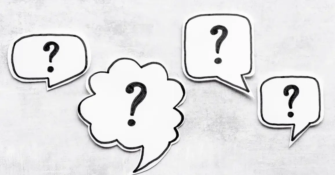 Question marks in speech bubbles on a grey background.