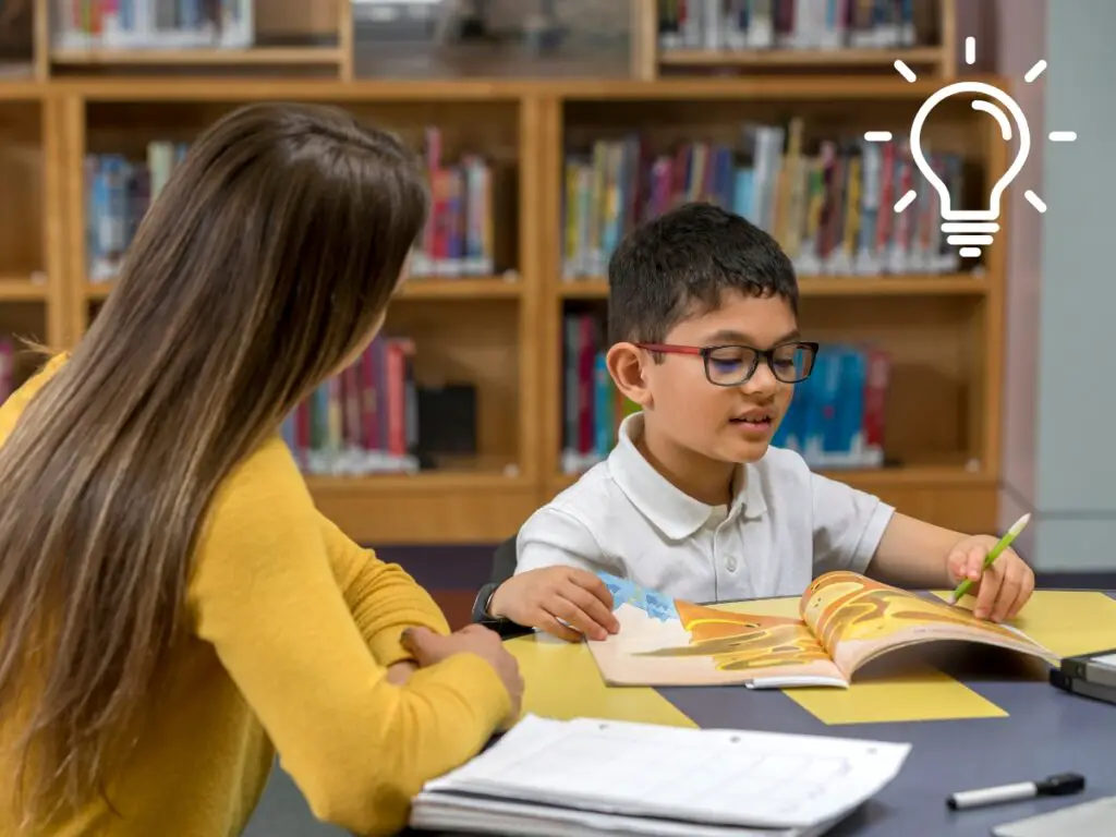 ESL teacher working one-on-one with a newcomer student who speaks no English.